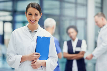 Your health is our only priority. Portrait of a young female doctor standing in a hospital with...