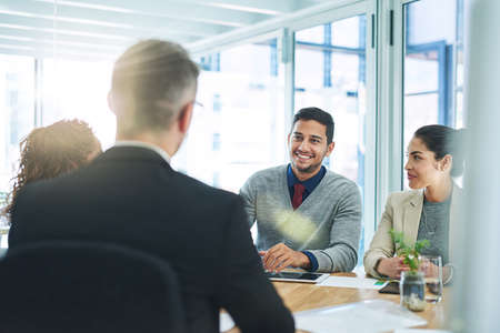 Success is the product of teamwork. Shot of corporate colleagues working together in their office.