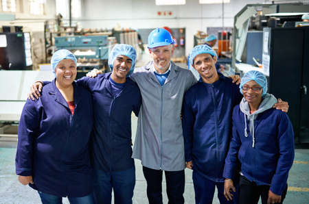 More than employees... Portrait of a people working inside a printing, packaging and distribution...