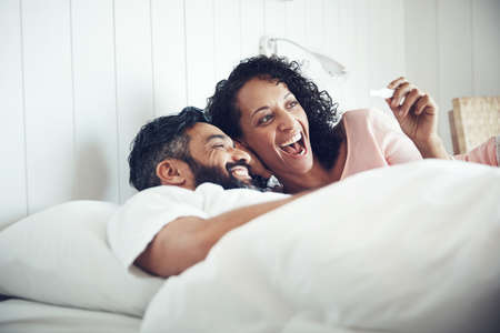 Oh baby, were having a baby. Shot of a mature couple feeling happy after taking a home pregnancy...