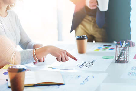 Lets focus on our customers. Cropped shot of unrecognizable businesspeople working together in an office.の写真素材