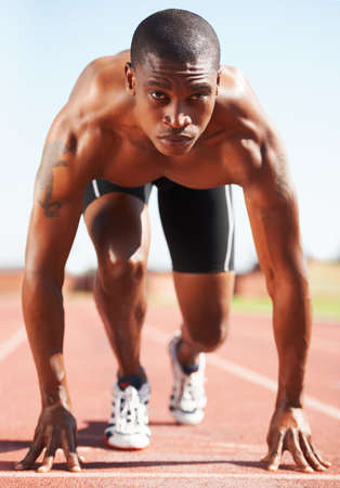 On your mark. A runner at the starting line.