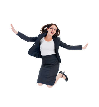 Success has her over the moon. Studio shot of an ecstatic looking businesswomen jumping for joy isolated on white.の写真素材