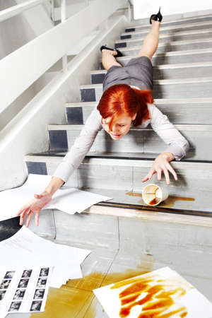 No, not my paperwork. A young businesswoman falling on the stairs and spilling coffee over her...
