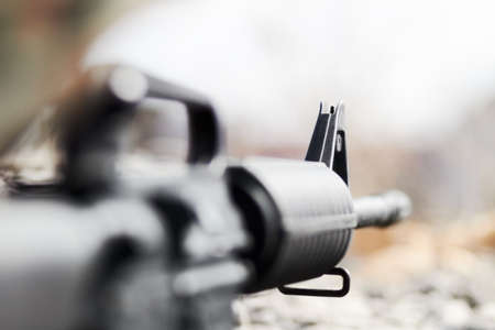 Weapons of war. Rearview closeup and selective focus of a barrel of a gun.の写真素材