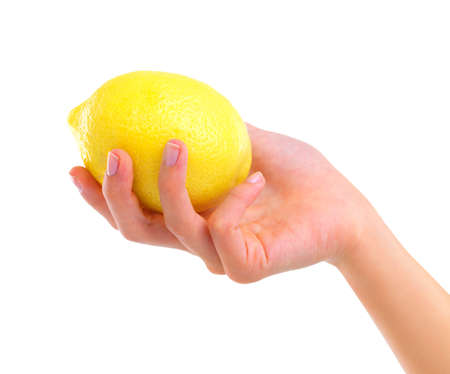 Tangy and delicious. Closeup studio shot of a woman holding a lemon isolated on white.の写真素材