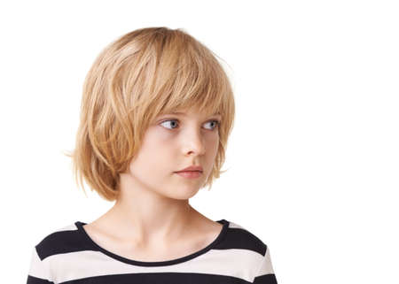 Shes simply sweet. Head and shoulder shot of a pretty little girl standing against a white...