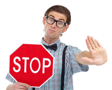 You better stop. Portrait of a stern-looking man holding out his hand warning you to stop.の写真素材