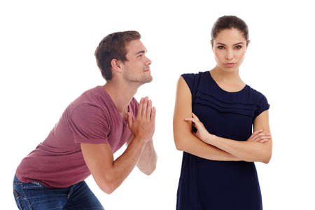 The way to win with a woman. Cropped shot of a gorgeous young couple arguing while standing in a...