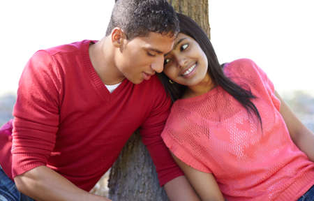 She shares his dreams. Shot of a happy young couple sharing an affectionate moment outdoors.