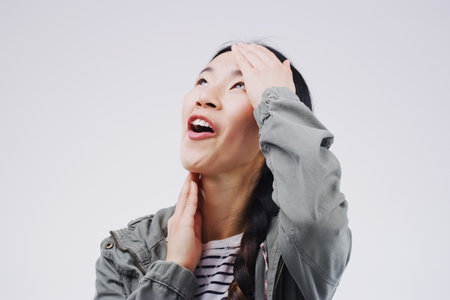 That just made my day. Studio shot of an attractive young woman looking surprised against a grey...