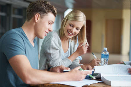 Wow, youre really good at this. A young college student helping a friend learn during a study group.