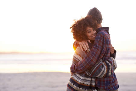 This is where I belong. Shot of a young couple enjoying a walk on the beach.