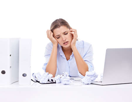 She cant come up with a solution. An attractive young woman looking frustrated at work.
