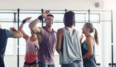 Strong people inspire other people to be strong. Shot of a group of young people motivating each...