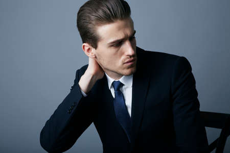 The modern man. Cropped shot of a handsome and fashionable young man posing in the studio.の写真素材