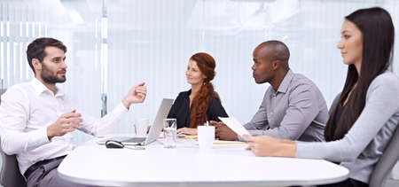 Do you see what Im aiming for . A group of colleagues sitting in an office meeting.