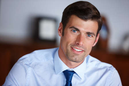 His business venture starts here. Cropped portrait of a handsome businessman sitting in his office.