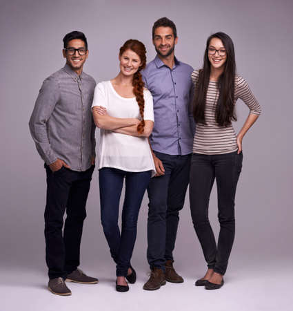 The team you can depend on. Studio shot of a group of diverse young people against a gray...