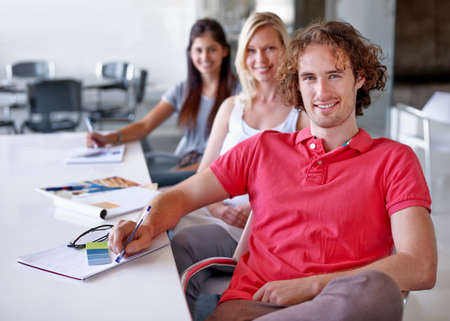 This teams creativity knows no bounds. Three creative professionals sitting in a line in their...
