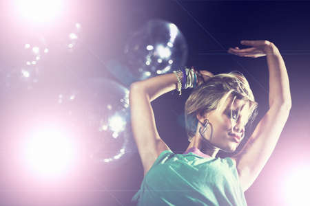 Partying the night away. Shot of an attractive and stylish young woman in a night club.