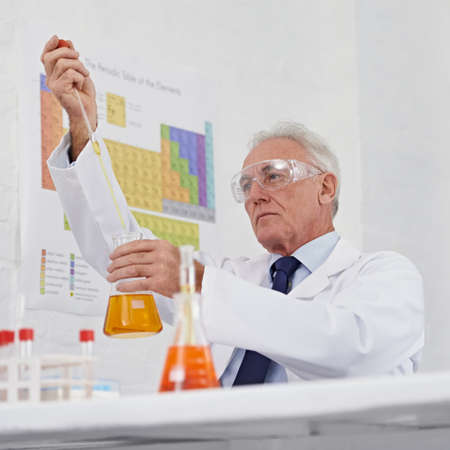 This is a delicate procedure. Low angle shot of a mature scientist working in a lab.の写真素材