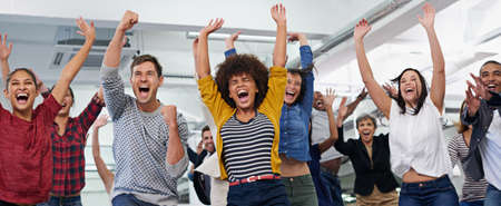 Theres no team like the A-team. Shot of a group of colleagues feeling overjoyed.の写真素材