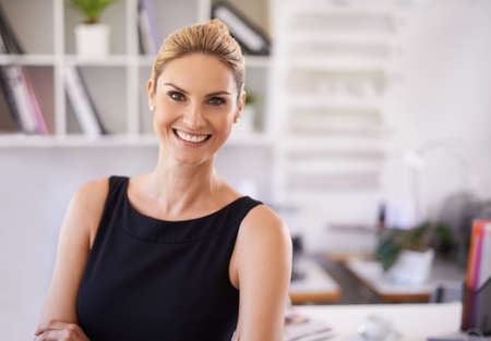 She was made for the business world. Portrait of an attractive woman standing in an officePortrait...