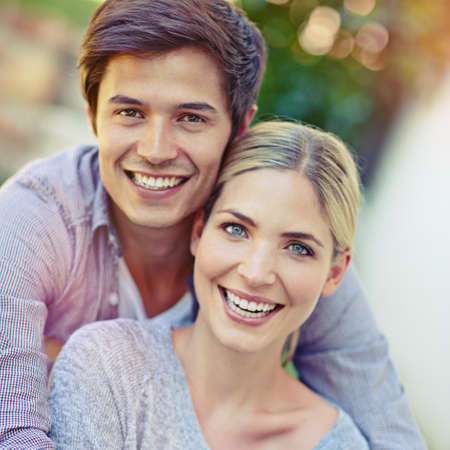In love forever. Portrait of a happy young couple enjoying an affectionate moment together outdoors.