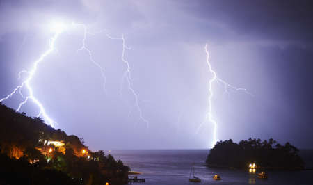 Nature in all its splendour. Shot of a dramatic thunderstorm over sea and land.