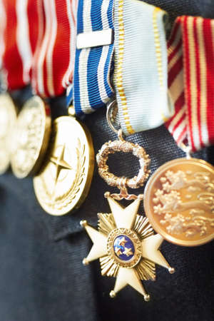 Medals for bravery. Cropped shot of war medals on a soliders suit.の写真素材