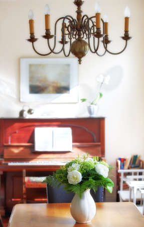 Flowers in the house. A warm photo of flower and dinning room (Danish).の写真素材