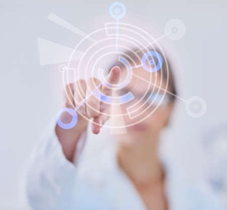 The marvels of mankinds genius. Shot of a scientist using a digital interface while standing in a...