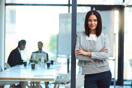 Know your skills, be confident in business. Portrait of a beautiful young businesswoman in the workplace.の写真素材