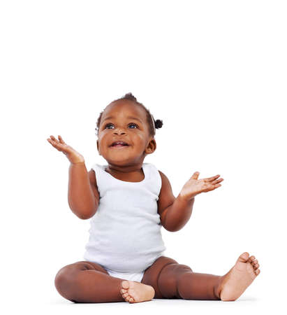 Nappy duty is served. Studio shot of an adorable baby girl isolated on white.の写真素材