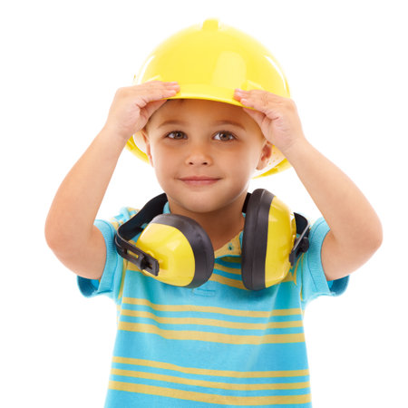 Bring on the noise. Studio shot of a cute young boy pretending to be a construction worker.の写真素材