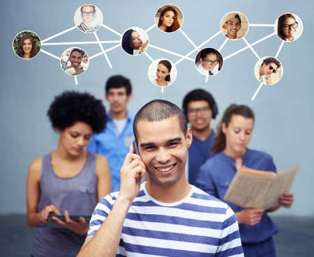 A shot of a man talking on his phone with all of his contacts standing on the background. All screen...