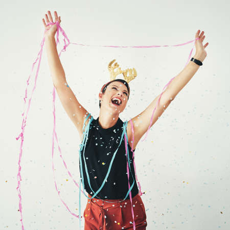 Never miss out on a chance to celebrate in life. Shot of an attractive and cheerful young woman...