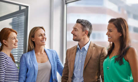 The corporate world. Cropped shot of corporate businesspeople in the office.