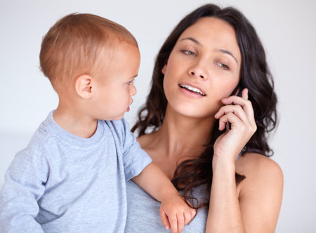 Just me and my baby. Cropped shot of a beautiful young woman and her baby at home.の写真素材