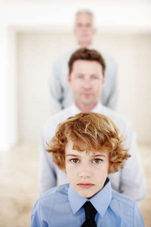 Hes the latest addition to his multi-generational family. Cropped portrait of a young boy standing...