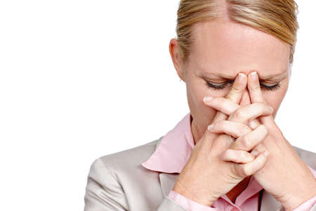 She just doesnt have a solution. Studio shot of a businesswoman looking stressed against a white background.の写真素材