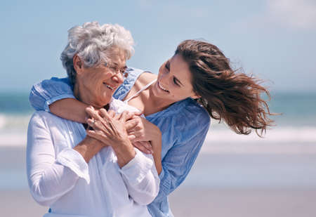 Taking time out to show some tenderness. Shot of a beautiful young woman and her senior mother on...