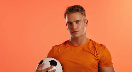 You got the skills. Studio portrait of a handsome young male soccer ball player posing with a ball...