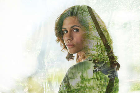 Conquering the concrete jungle. Multiple exposure shot of young businesswoman superimposed over a...