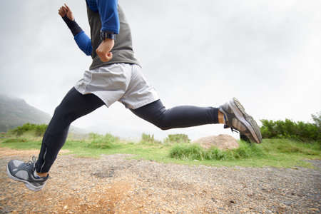 Enjoying a jog in the crisp winter air. A young man running outdoors.