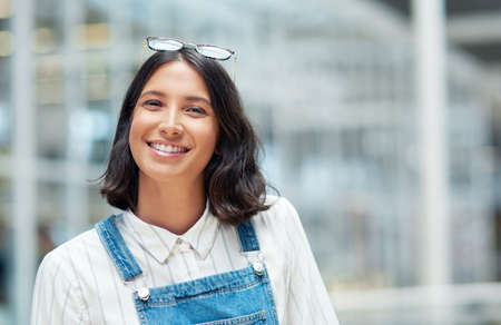 You wont grow by staying inside your comfort zone. Portrait of a confident young businesswoman...