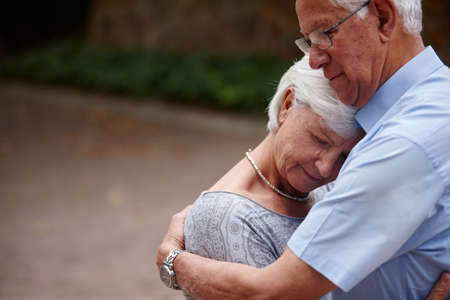 Marriage doesnt have to be perfect to be beautiful. Shot of a senior man consoling his wife.の写真素材