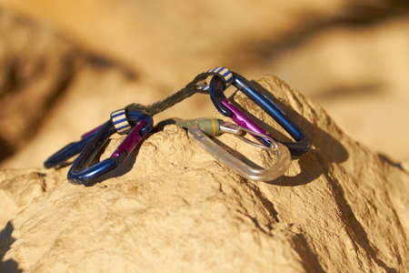 The climbers best friend. Carabiners lying on a rock.の写真素材