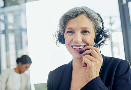 Let me help you find all the solutions you need. Portrait of a friendly support agent working in an...